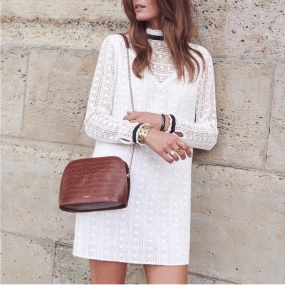 Sezane white crochet dress with black velvet band details.